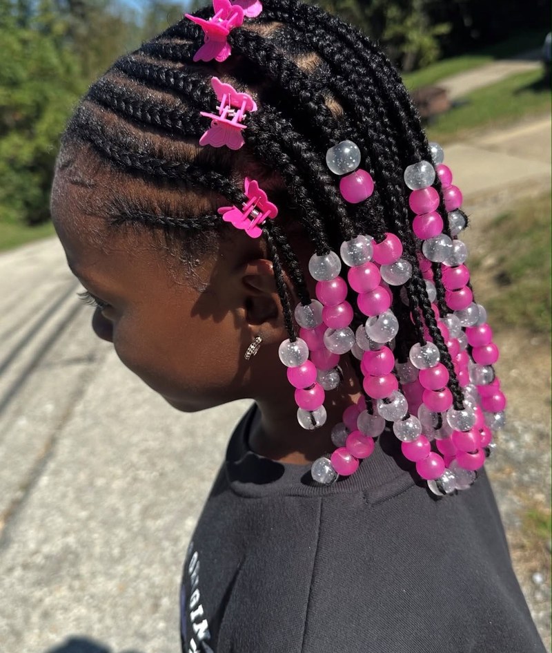 Kids braids with pink beads and butterfly clips